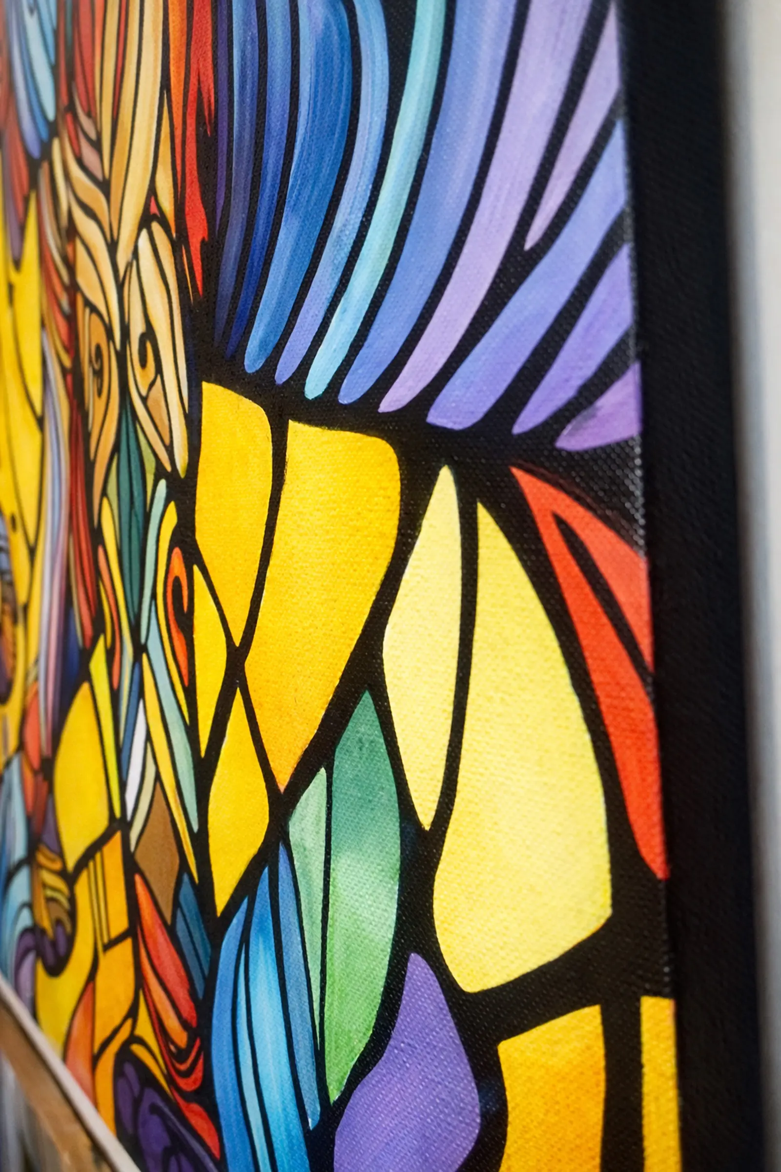 Side angle view of Timeless Wisdom elephant painting showing canvas edge depth and painted surface texture