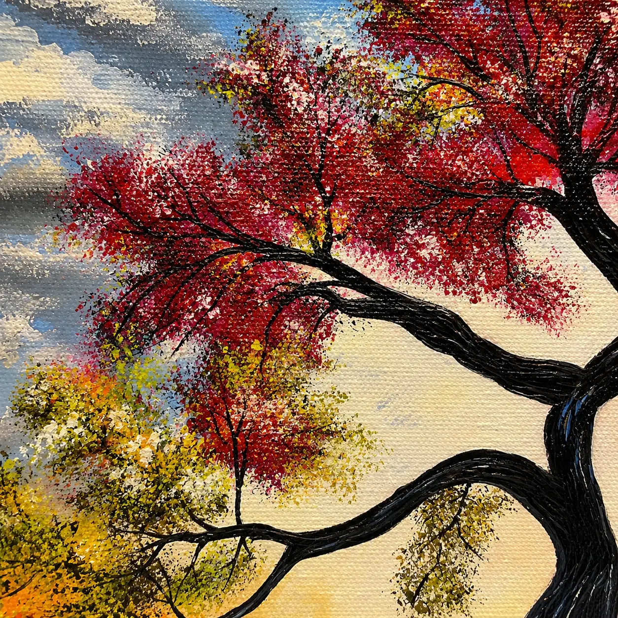 Close-up view of layered acrylic textures and vibrant foliage details in Seasons of Life tree painting.